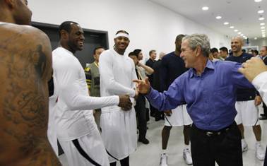 Lebron james shakes hands with George w bush in beijing, China
