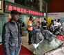 Out of Africa and into China, emigres struggle