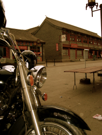 motorcycle parked in small Chinese town