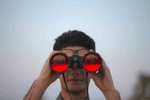 man with binoculars