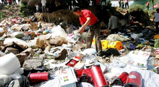 An Early Christmas: Villagers Pillage Goods from a Flipped Over Truck