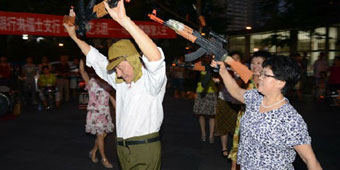 Middle Aged Aunties Rehearse ‘Anti-Japanese’ Dance at Raffles City Beijing 