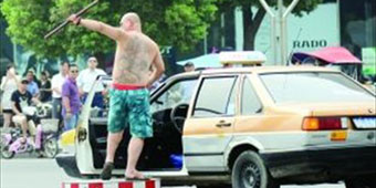 Grumpy Cabbie Pulls Officer from Post, Directs Traffic 