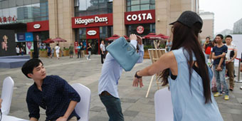 Woman Hits Boyfriend With ‘Designer’ Purse After Discovering it is Fake