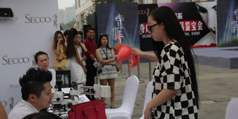 Woman Takes off Bra in Street in Luxury Handbag Dispute