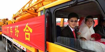 Groom Takes Bride Home on Crane 