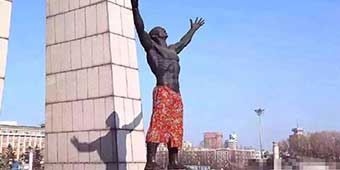 Young Changchun Artists Put Giant Flowery Pants on Naked Statue 